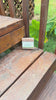 Video: SoftWell Oat Milk + Honey soap bar on a wooden garden bench with green leaves